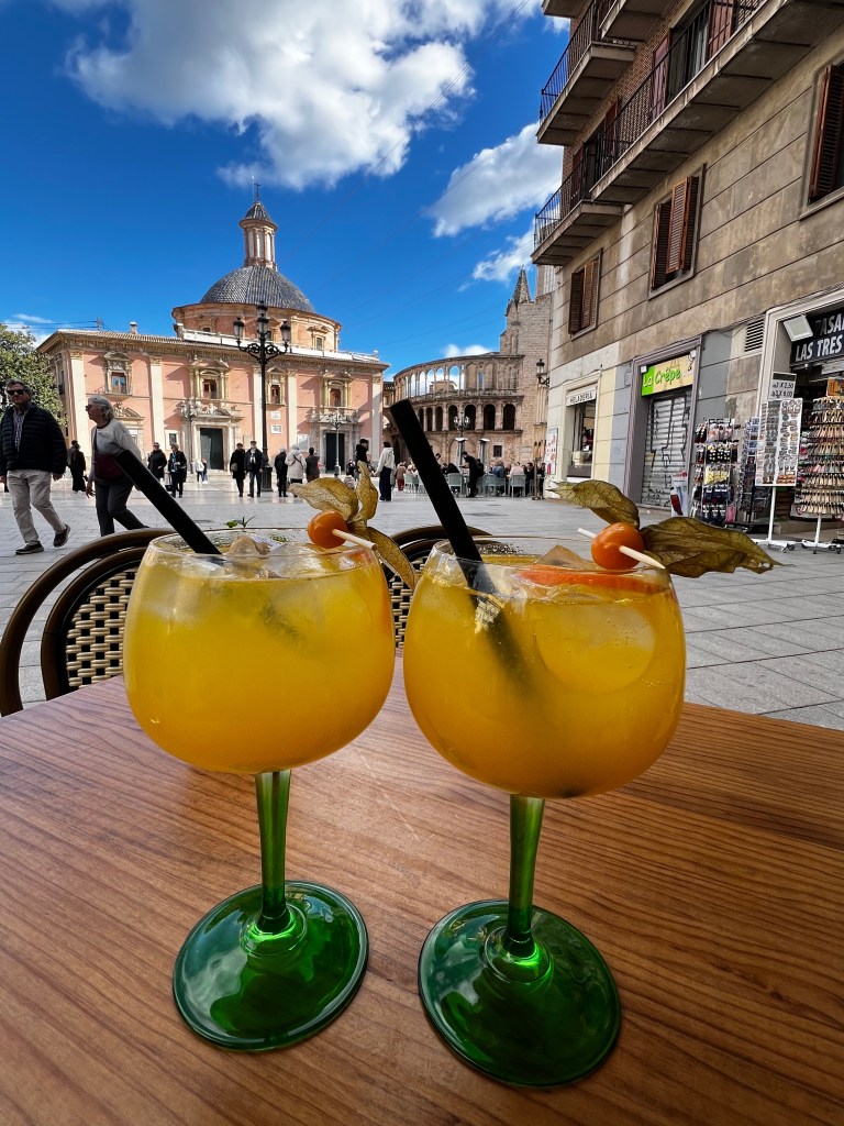 Drinking agua de Valencia in the old town center of Valencia.